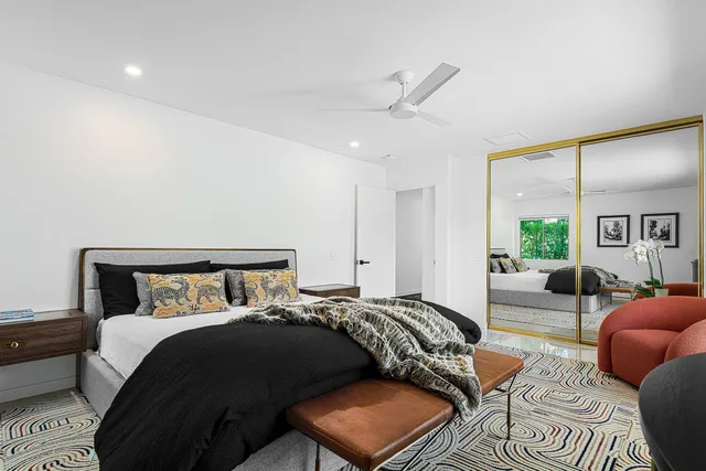 a aerial view of residential houses with outdoor space and trees