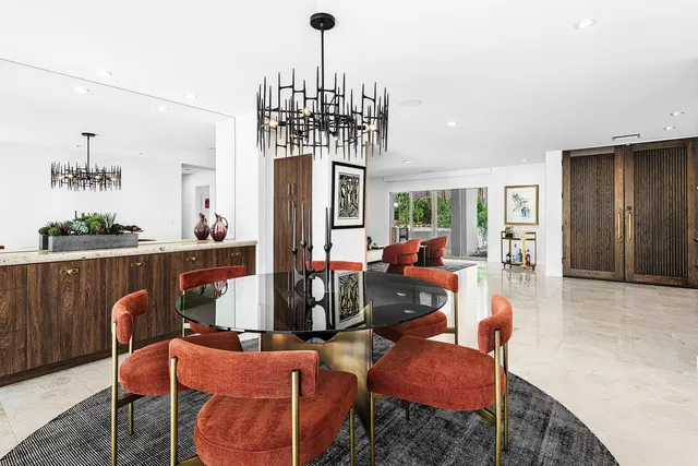 a kitchen with stainless steel appliances granite countertop a sink and a stove