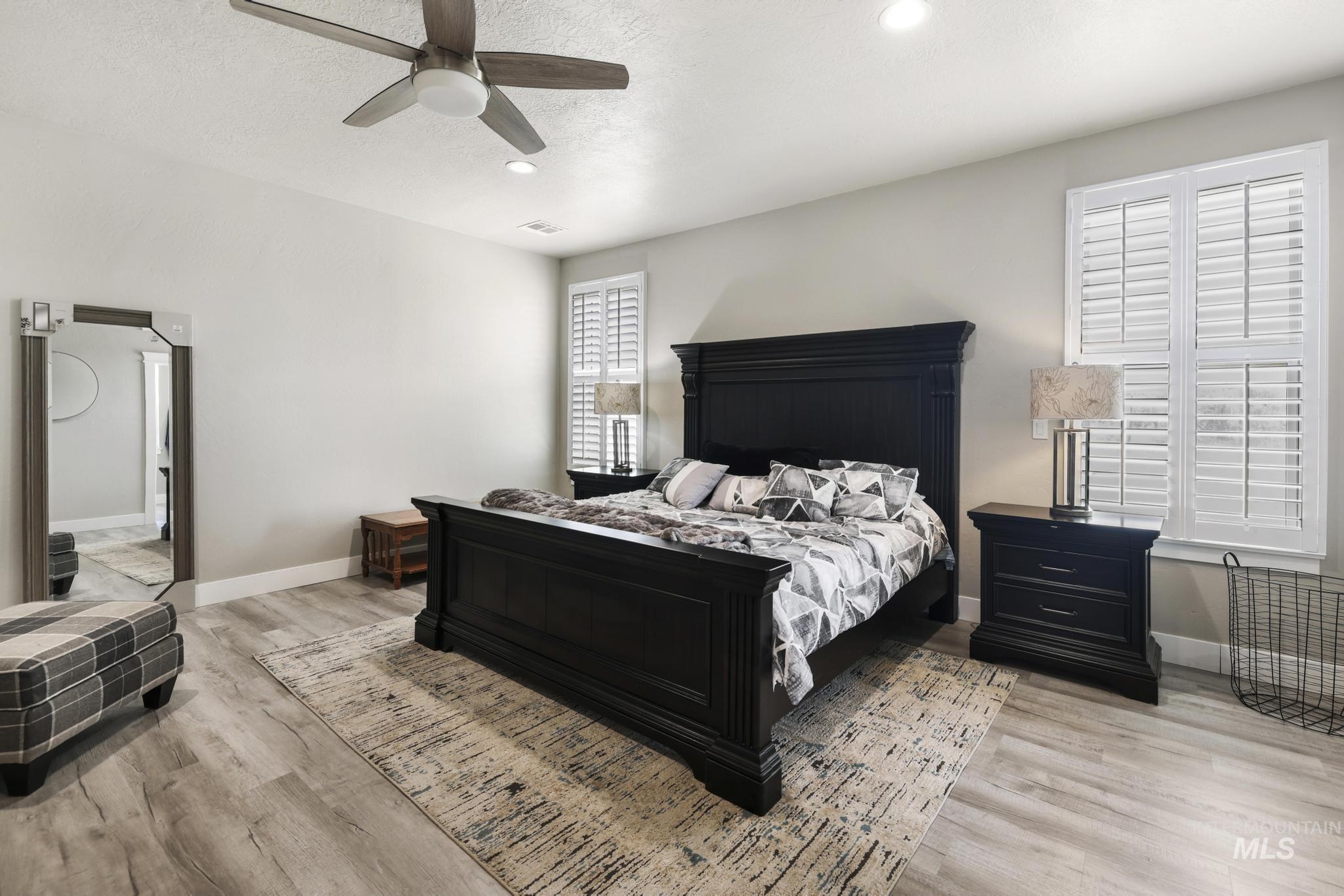 758 Cedar Crk Road Rogerson, ID 83302 - Photo 18 of 50 Bedroom featuring light wood-finish flooring, recessed lighting, and a ceiling fan with light
