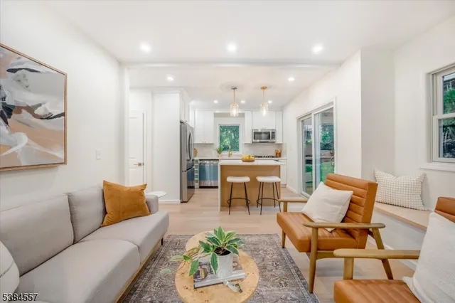 a living room with furniture and a table
