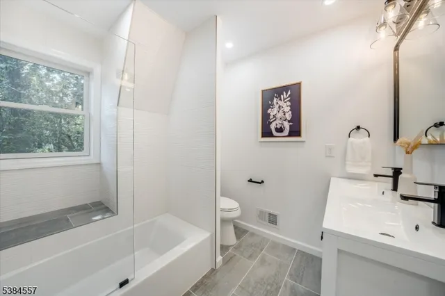 a bathroom with a sink and a bathtub