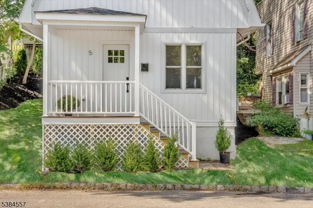 a view of a house with a small yard
