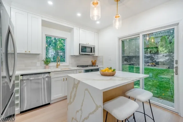 a kitchen with a table chairs and microwave