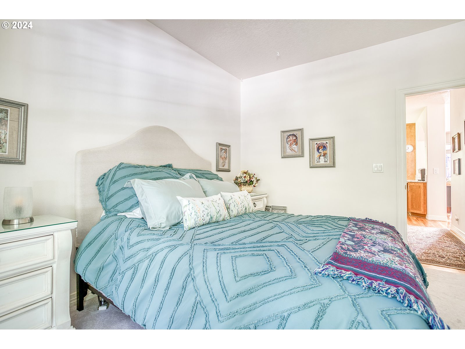 115 Southwest Cormorant Depoe Bay, OR 97341 - Photo 39 of 47 a bedroom with a bed and a lamp