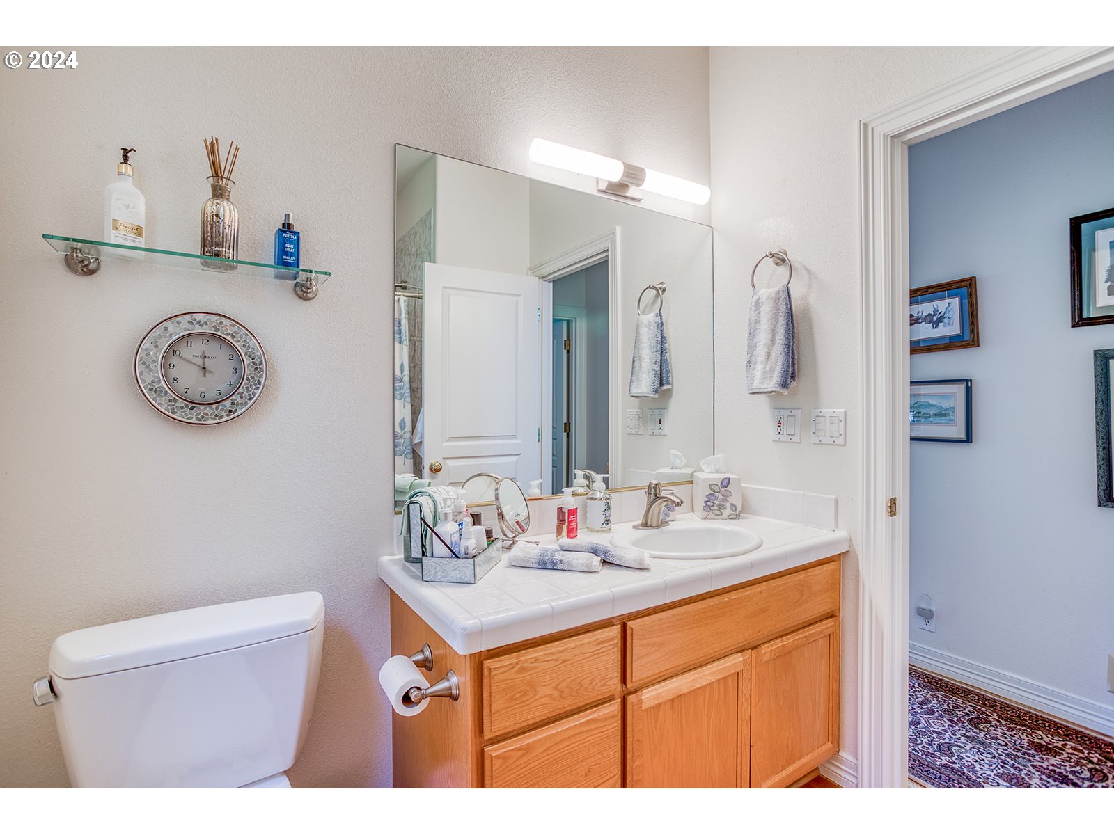 115 Southwest Cormorant Depoe Bay, OR 97341 - Photo 41 of 47 a bathroom with a sink vanity and a mirror