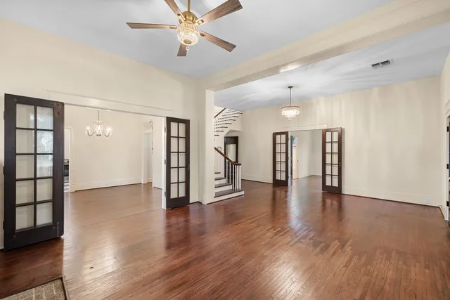 a view of entryway with wooden floor and stairs