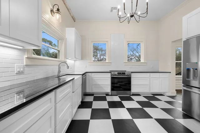 a bedroom with furniture and a window