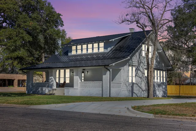 wooden floor in an empty room with a fireplace