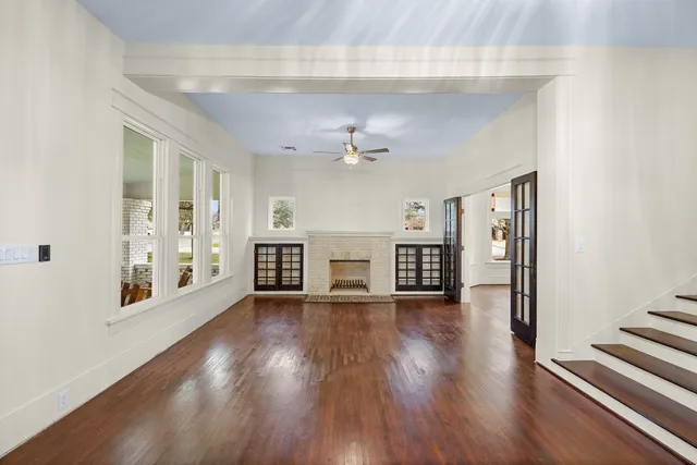 a kitchen with a checkered floor and white cabinets