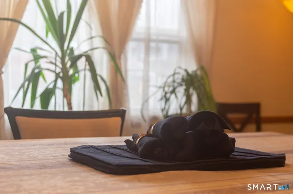 a view of a bedroom with a bed and a window