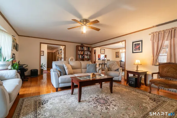 a living room with furniture and a rug