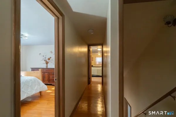 a view of a hallway with a room