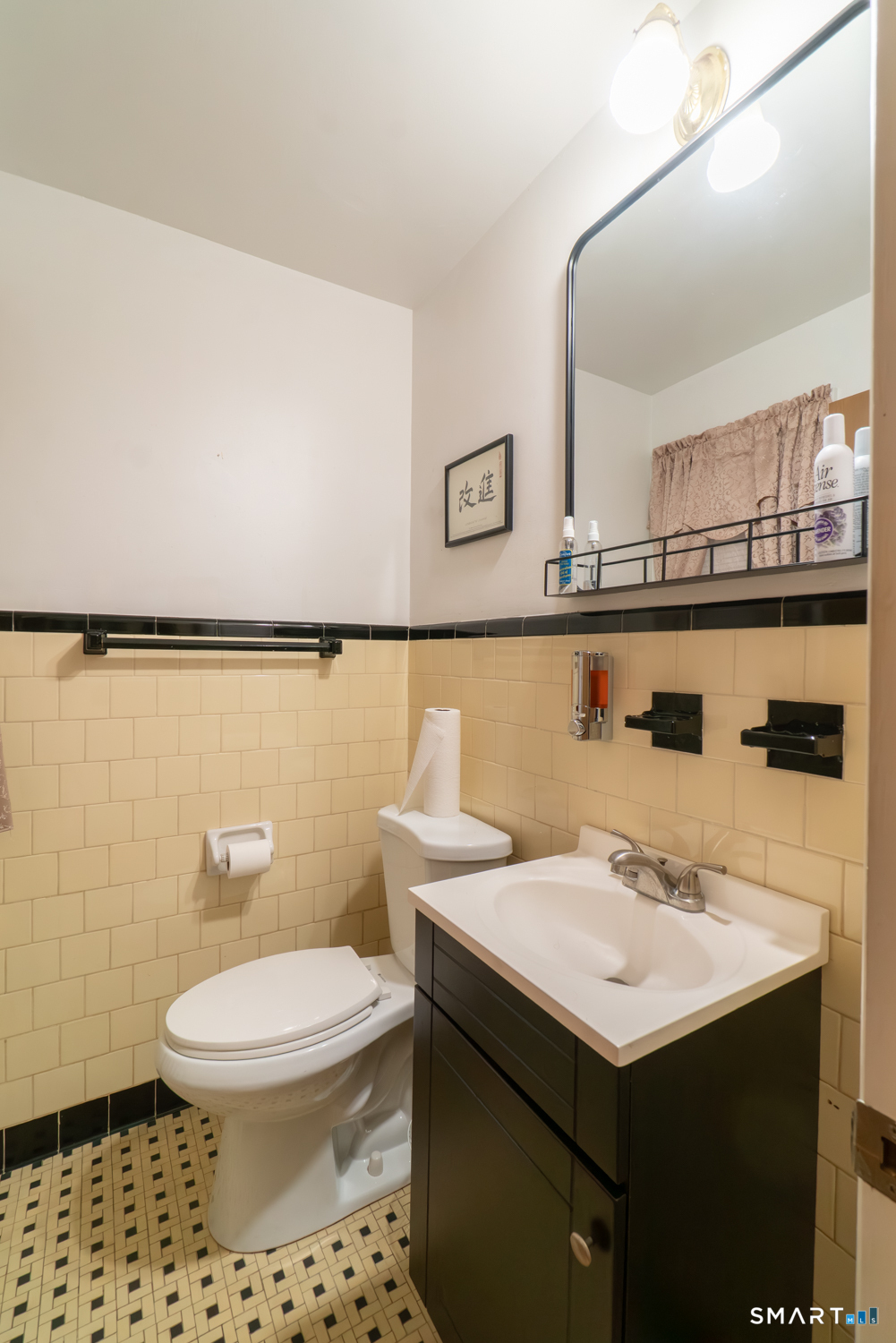 224 Ray Road New Haven, CT 06515 - Photo 6 of 37 a bathroom with a sink a toilet and mirror