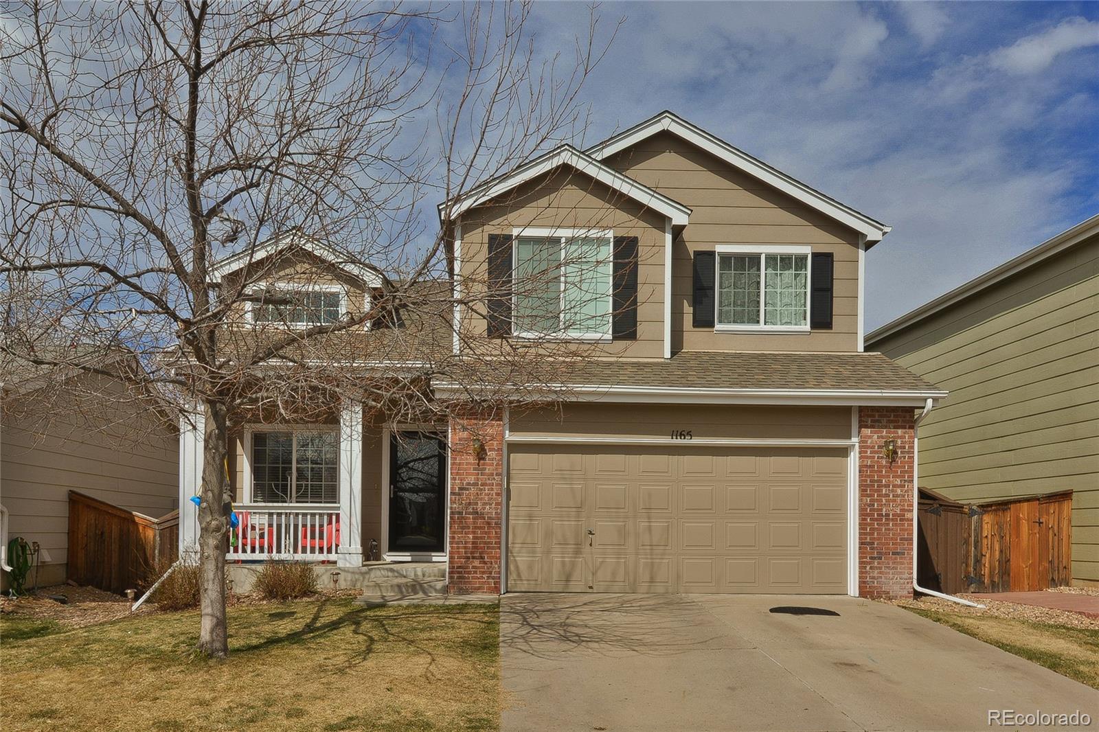 1165 Timbervale Trail Highlands Ranch, CO 80129 - Photo 1 of 29 a front view of a house with garden