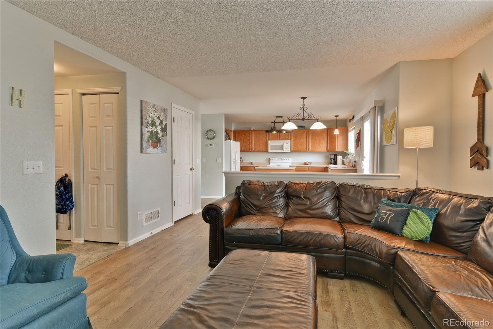1165 Timbervale Trail Highlands Ranch, CO 80129 - Photo 11 of 29 a living room with furniture and a couch