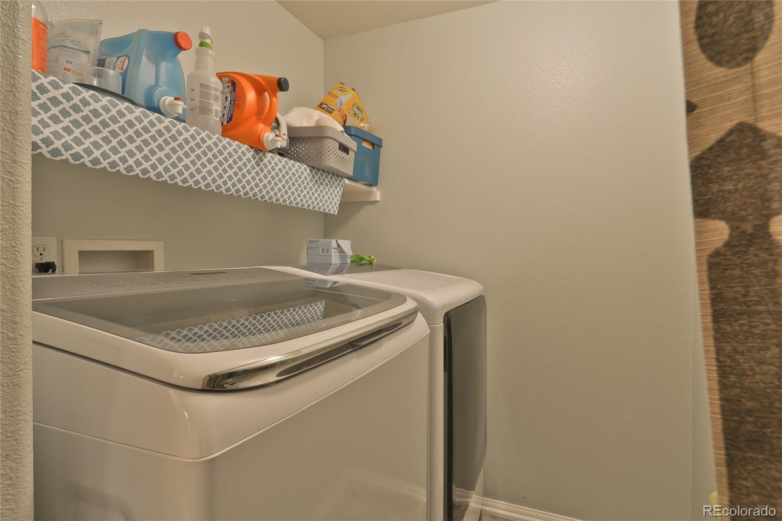 1165 Timbervale Trail Highlands Ranch, CO 80129 - Photo 14 of 29 a close up of a sink washer and dryer