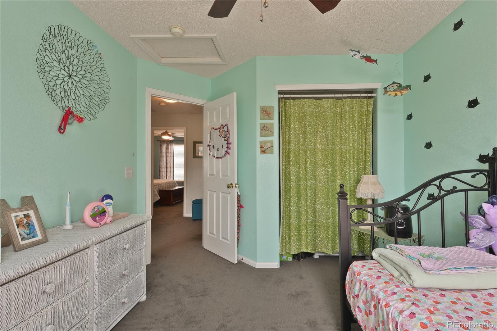 1165 Timbervale Trail Highlands Ranch, CO 80129 - Photo 20 of 29 a bedroom with a bed and a window