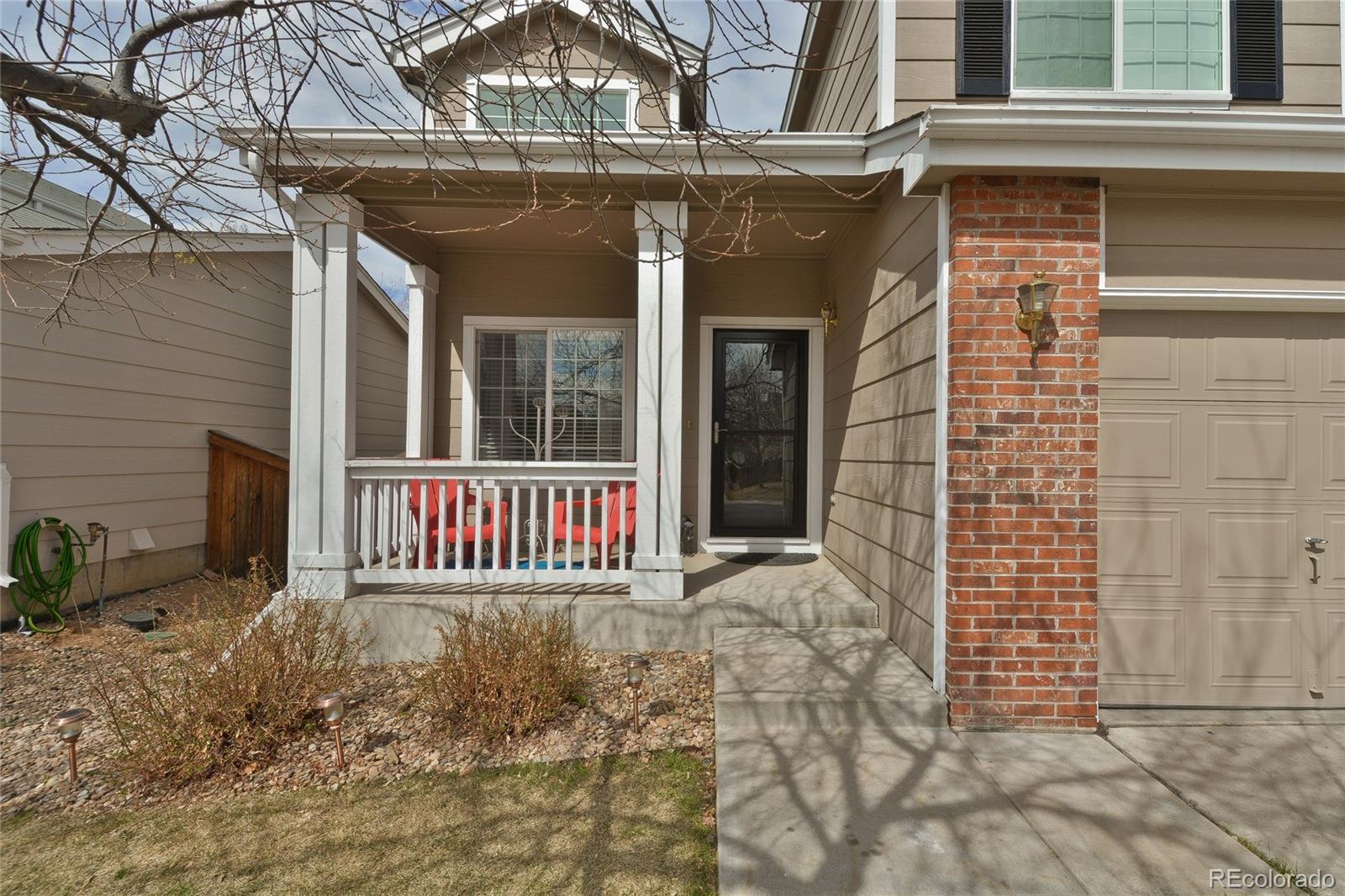 1165 Timbervale Trail Highlands Ranch, CO 80129 - Photo 3 of 29 a front view of a house