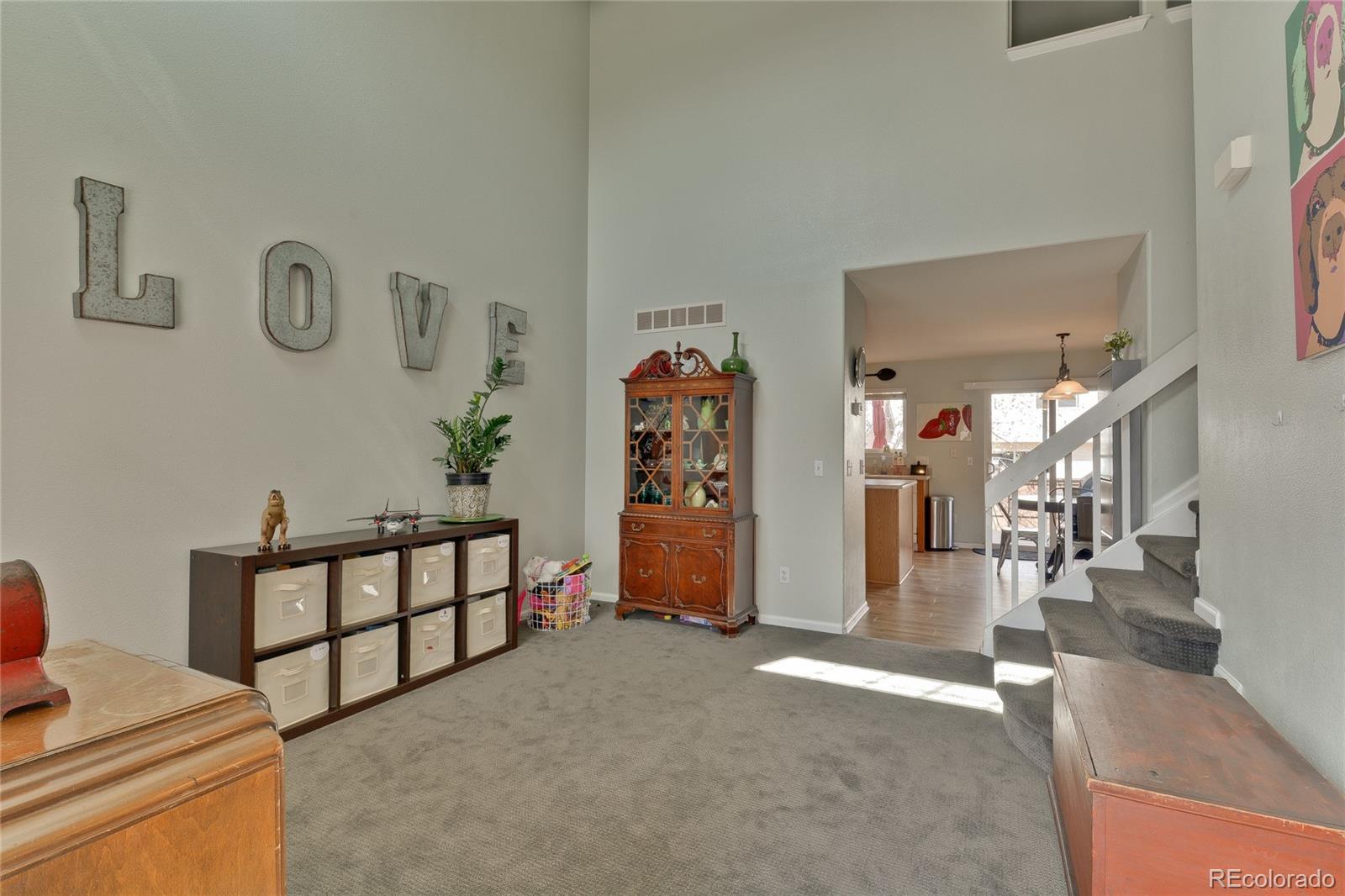 1165 Timbervale Trail Highlands Ranch, CO 80129 - Photo 4 of 29 a view of livingroom with furniture and toys