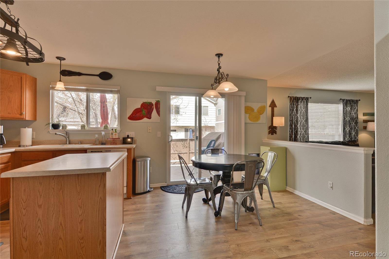1165 Timbervale Trail Highlands Ranch, CO 80129 - Photo 9 of 29 a view of a dining room with furniture and window