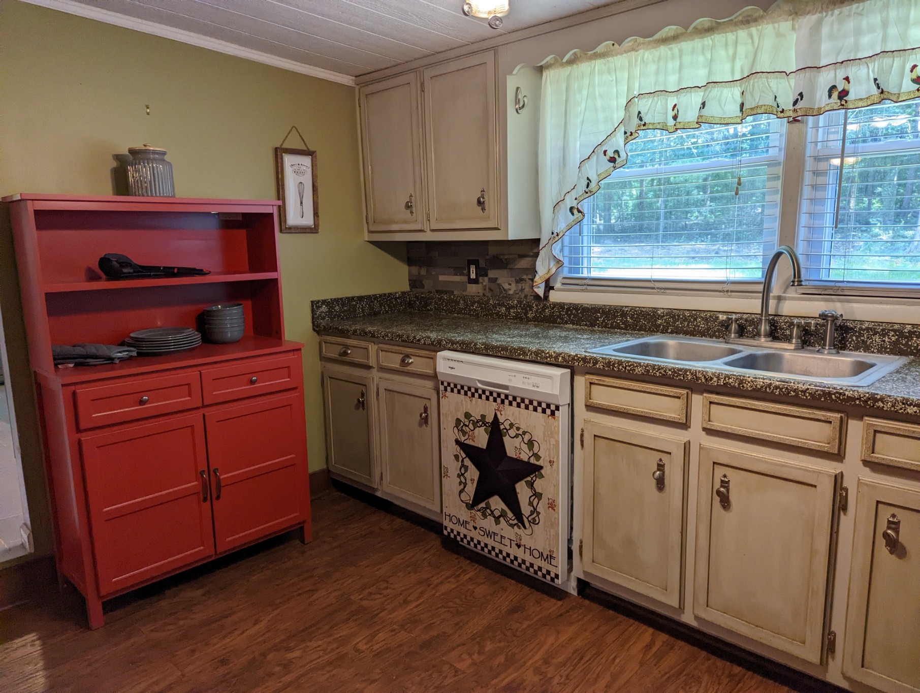 4747 Jones Road Christiana, TN 37037 - Photo 17 of 29 a kitchen with stainless steel appliances granite countertop a sink a stove cabinets and wooden floor