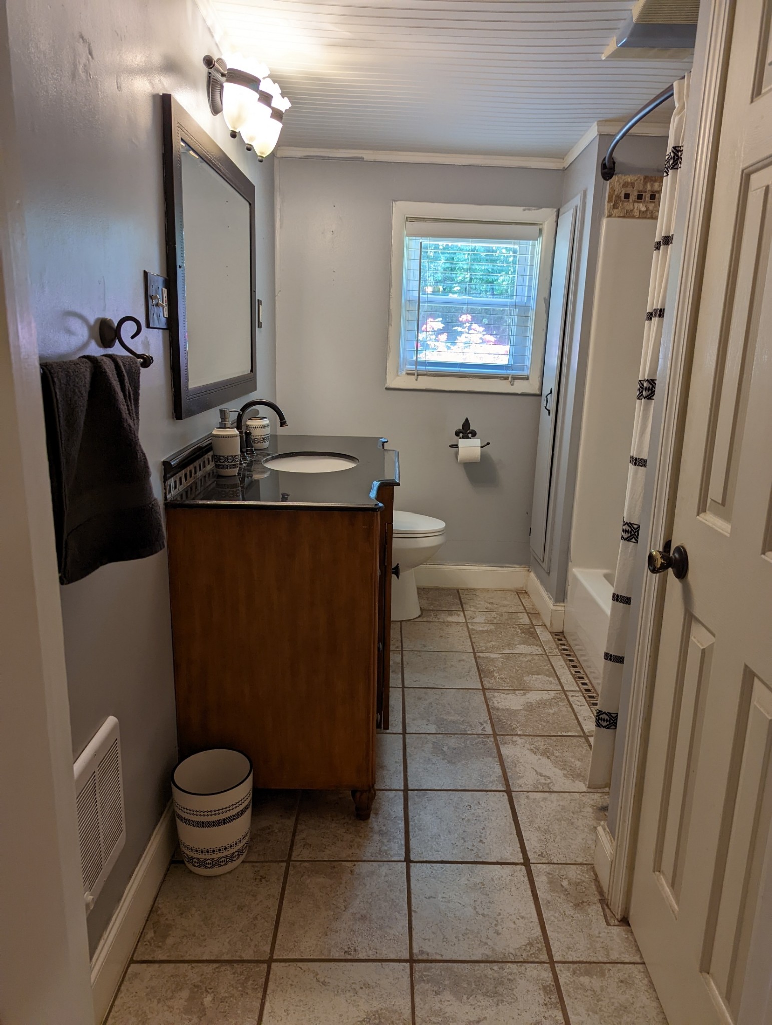 4747 Jones Road Christiana, TN 37037 - Photo 20 of 29 a bathroom with a granite countertop sink a toilet a mirror and tub