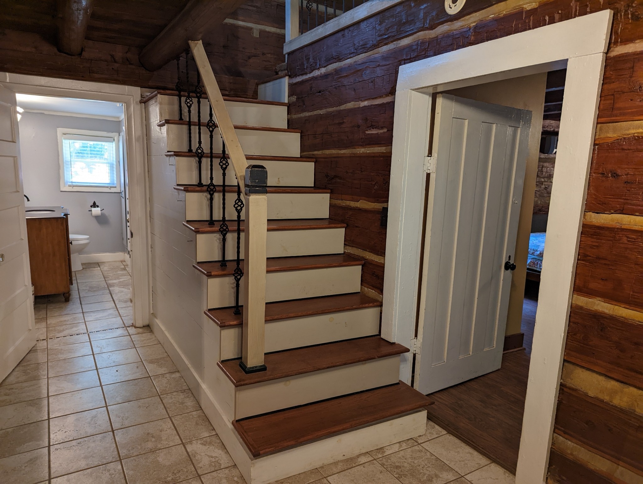 4747 Jones Road Christiana, TN 37037 - Photo 21 of 29 a view of a hallway with wooden cabinets and stairs