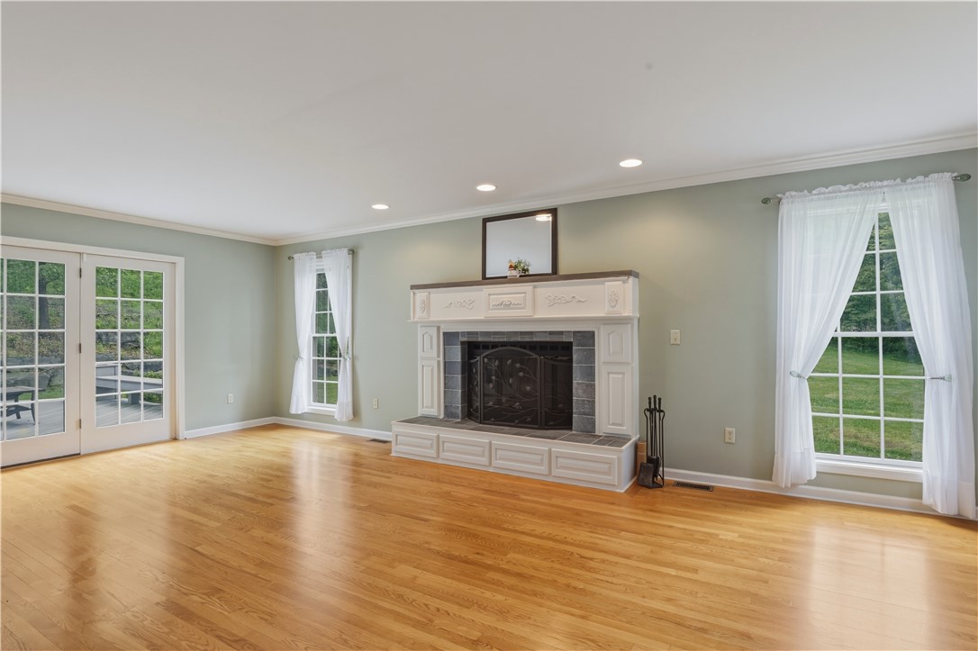 3200 Goff Road Corning, NY 14830 - Photo 5 of 50 Living Room with hardwood flooring and a wood burn