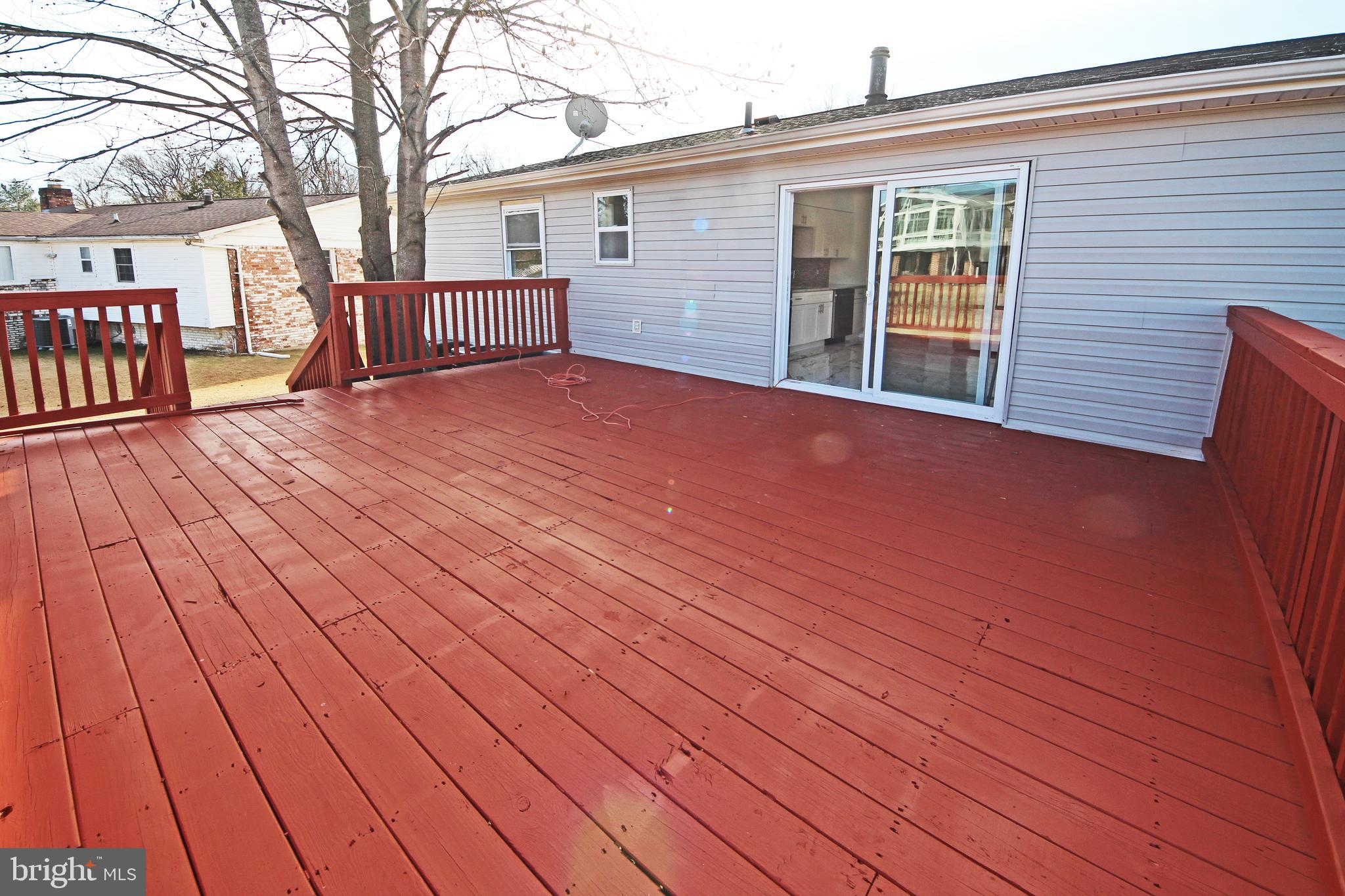 8916 Goldfield Place Clinton, MD 20735 - Photo 3 of 24 a view of a house with a backyard