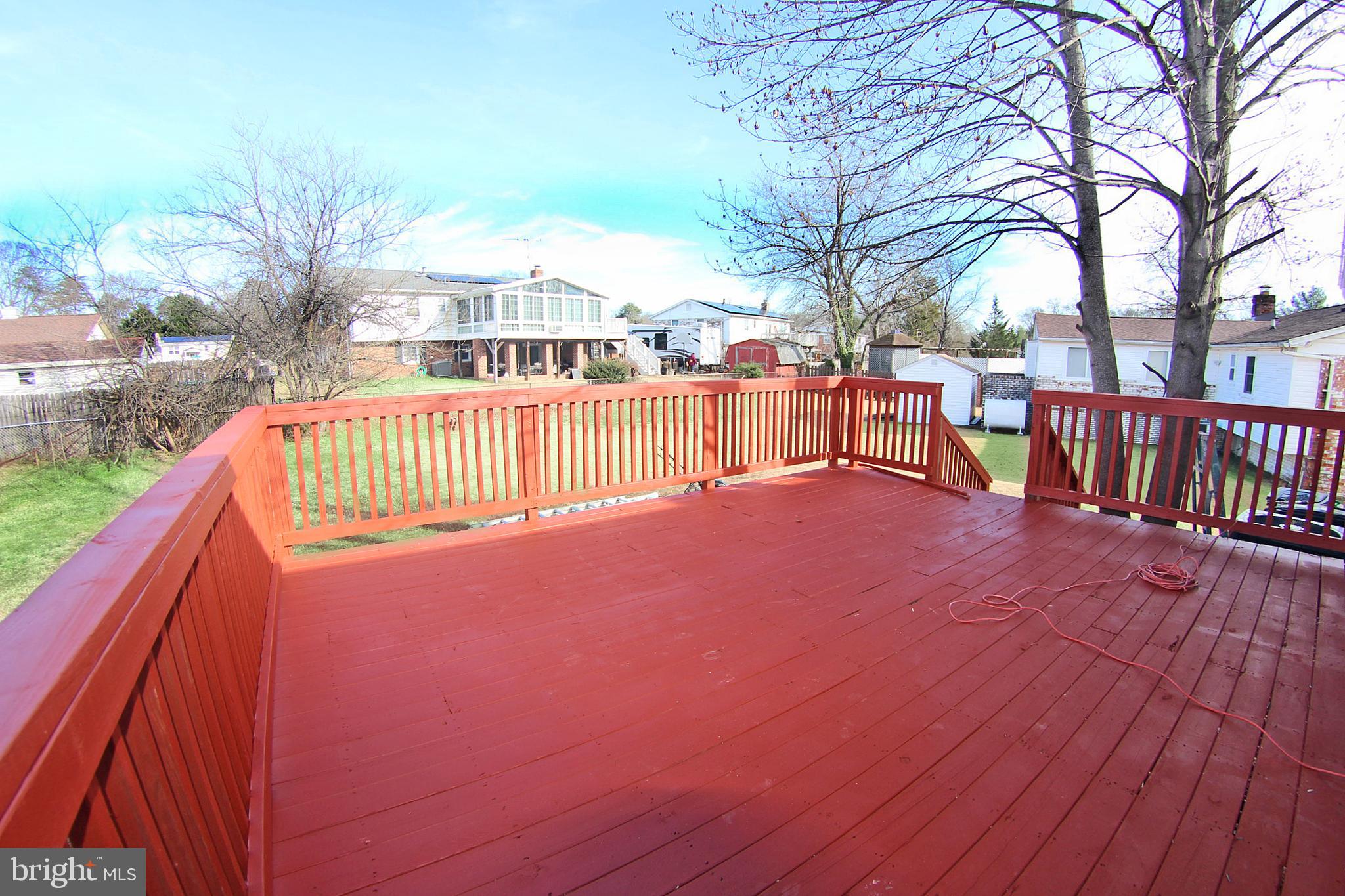 8916 Goldfield Place Clinton, MD 20735 - Photo 4 of 24 a view of roof deck with two couches and wooden floor