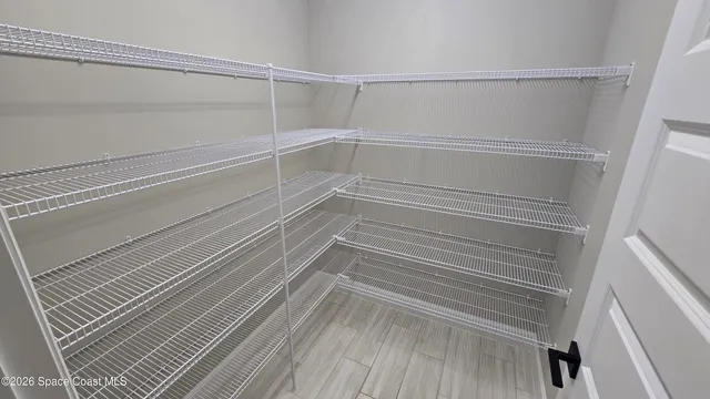 a view of an empty walk in closet