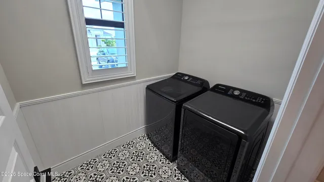 a utility room with dryer and washer