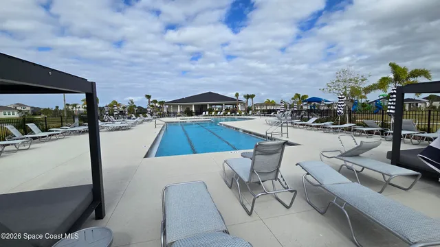 a view of a patio with swimming pool