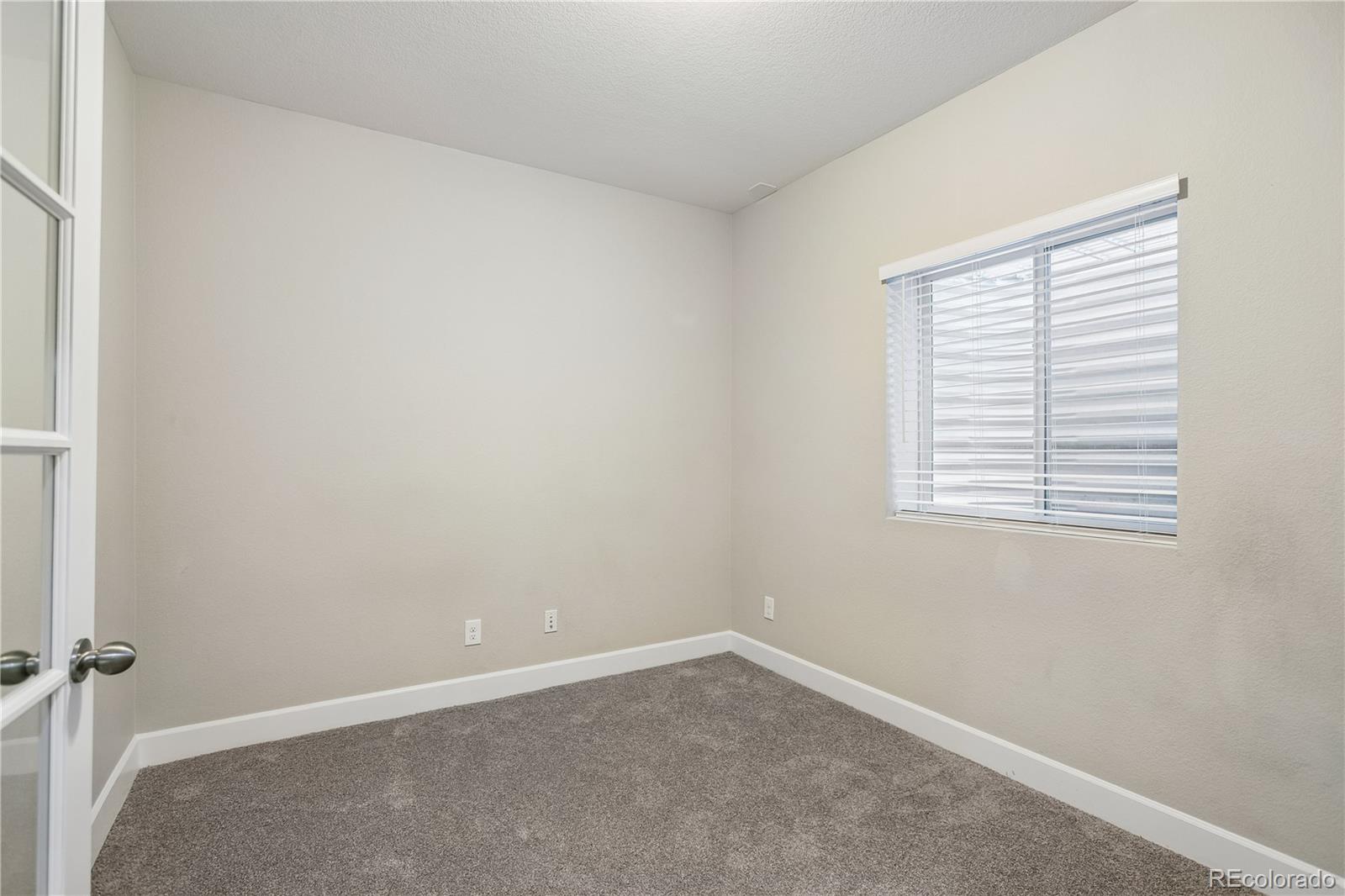 5031 South Rome Street Aurora, CO 80015 - Photo 31 of 39 an empty room with a window