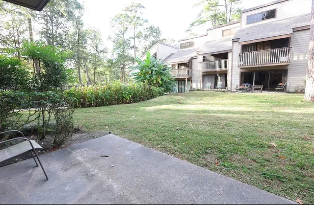 an aerial view of a house with outdoor space