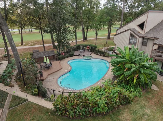 a view of a swimming pool with an outdoor space