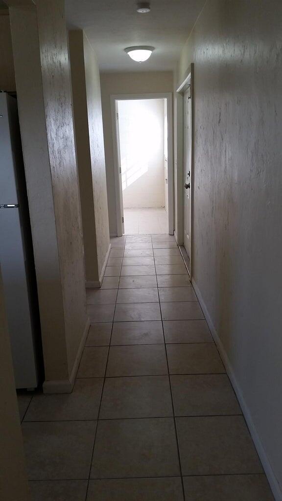 1230 West 23rd Street Riviera Beach, FL 33404 - Photo 12 of 19 a view of hallway with a mirror