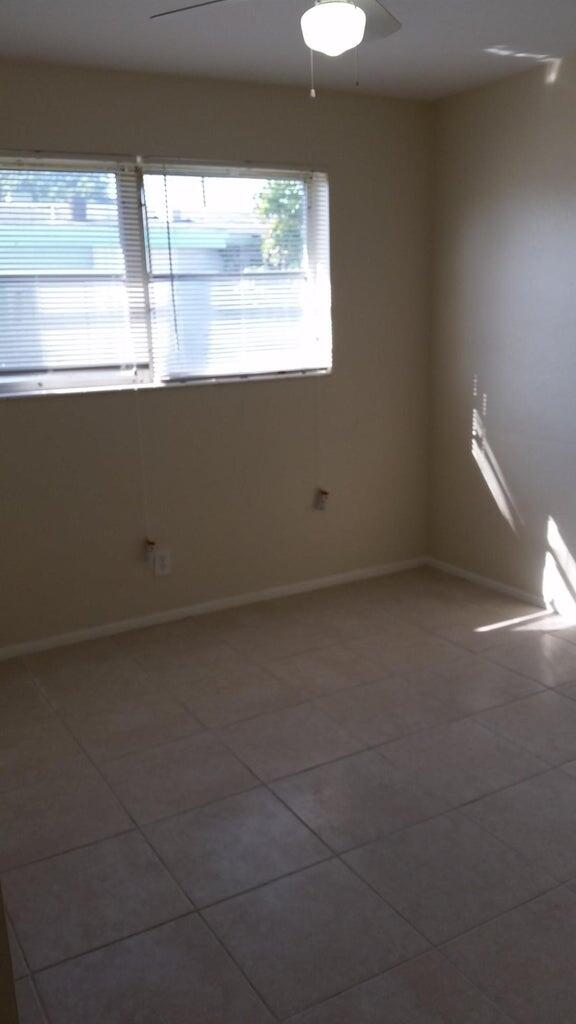 1230 West 23rd Street Riviera Beach, FL 33404 - Photo 14 of 19 a view of an empty room with a window