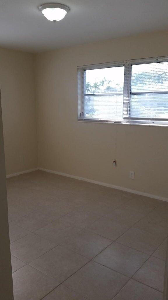 1230 West 23rd Street Riviera Beach, FL 33404 - Photo 16 of 19 a view of an empty room with a window