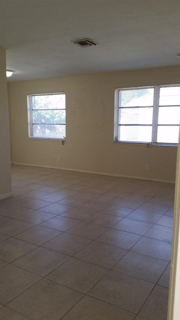 1230 West 23rd Street Riviera Beach, FL 33404 - Photo 2 of 19 a view of room with window