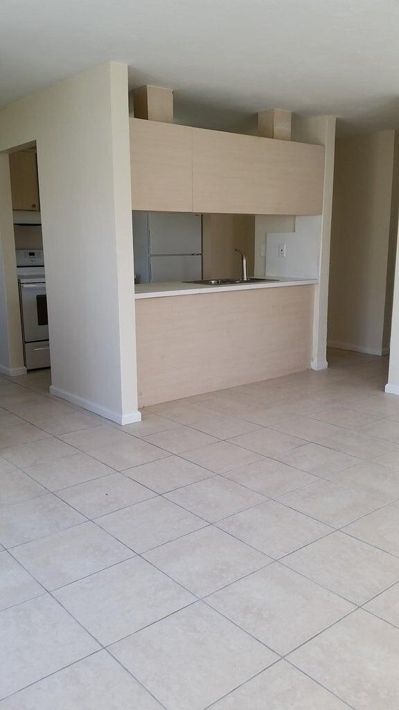 1230 West 23rd Street Riviera Beach, FL 33404 - Photo 3 of 19 a living room with a bench