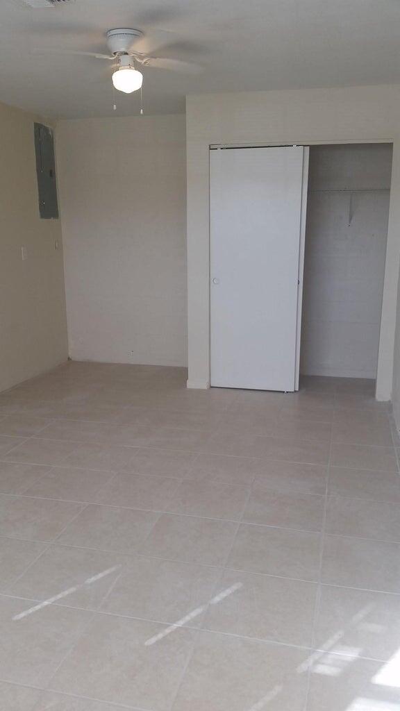 1230 West 23rd Street Riviera Beach, FL 33404 - Photo 9 of 19 a view of an empty room
