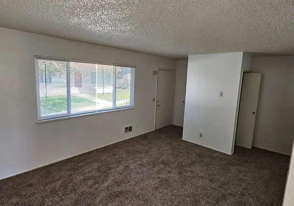 a view of an empty room with a window