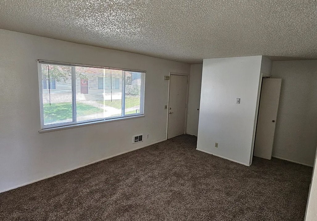 835 West Main Street St. Anthony, ID 83445 - Photo 4 of 8 a view of an empty room with a window