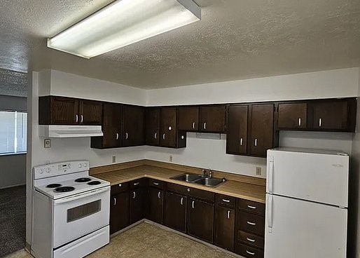835 West Main Street St. Anthony, ID 83445 - Photo 5 of 8 a kitchen with a stove and a refrigerator
