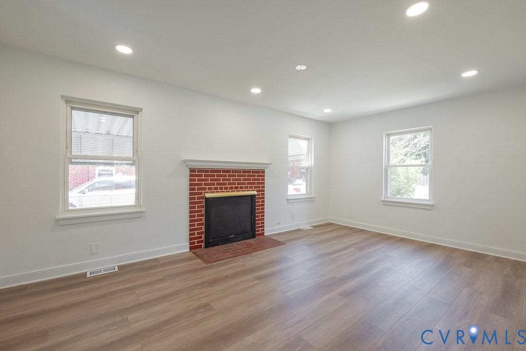 3400 Ryburn Road Richmond, VA 23234 - Photo 11 of 45 Bright living space featuring a red brick fireplac