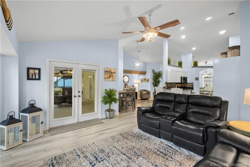 2457 Southeast Issac Road Port St. Lucie, FL 34952 - Photo 19 of 51 a living room with furniture and a ceiling fan