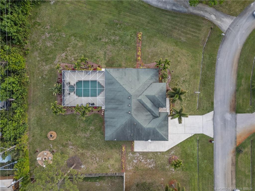 2457 Southeast Issac Road Port St. Lucie, FL 34952 - Photo 30 of 51 an aerial view of a house with a yard