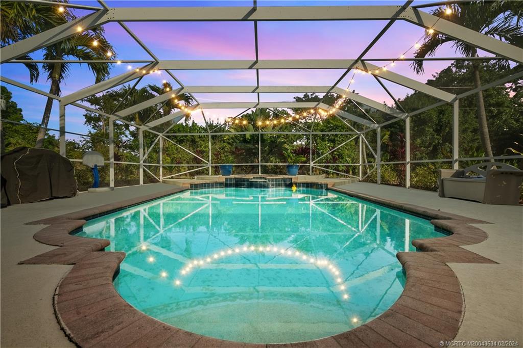 2457 Southeast Issac Road Port St. Lucie, FL 34952 - Photo 3 of 51 a view of a swimming pool with a yard