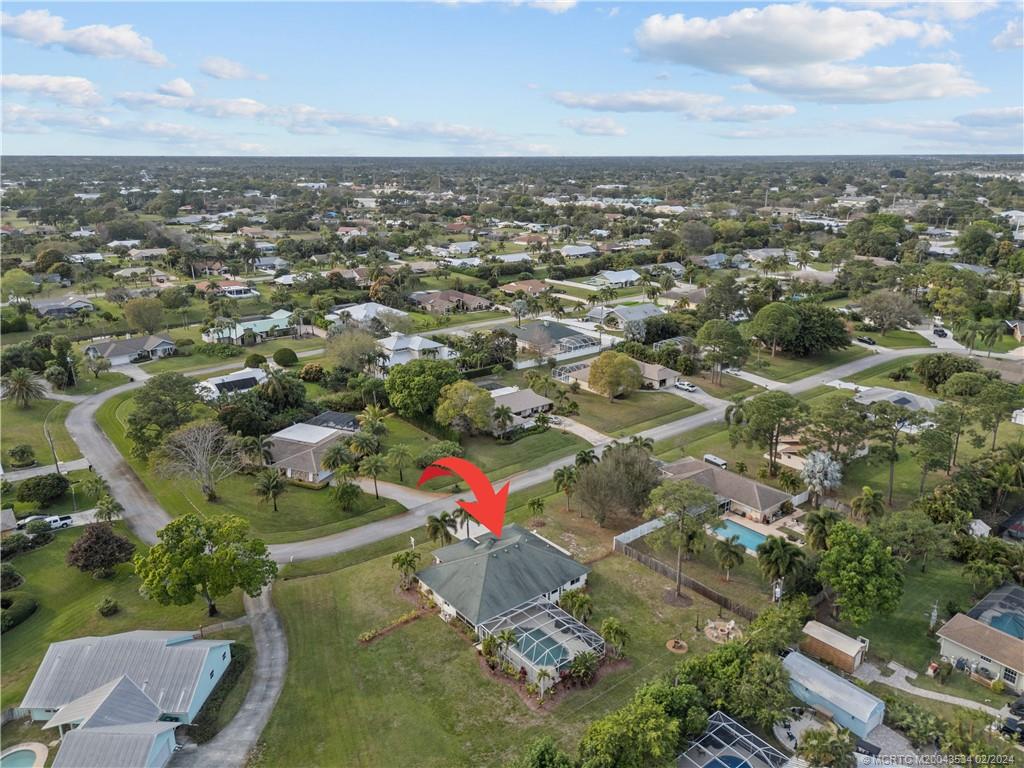 2457 Southeast Issac Road Port St. Lucie, FL 34952 - Photo 33 of 51 an aerial view of residential houses with outdoor space and trees